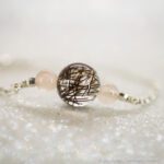 Silber mit Tierhaar und Rosenquarz. Haare gestreut.